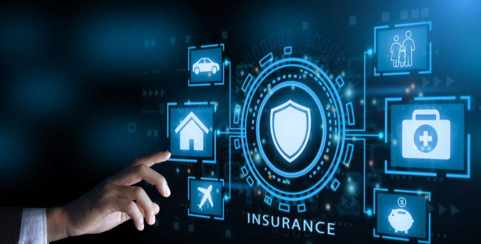 Couple reviewing household finances together with laptop and bills